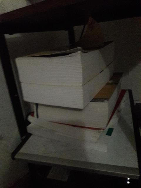 a stack of five textbooks.